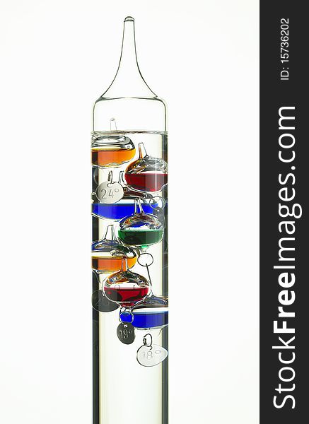 Galileo glass thermometer on white background