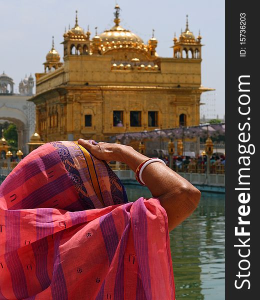 Lady/woman looking at Golden Temple, Amritsar, Punjab, India. Lady/woman looking at Golden Temple, Amritsar, Punjab, India