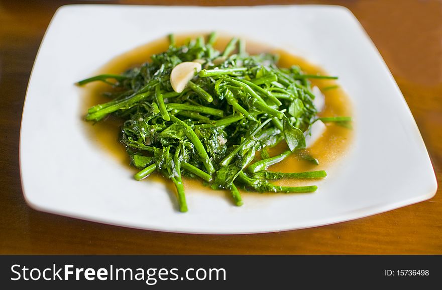 A plate of stir fried vegetables. A plate of stir fried vegetables