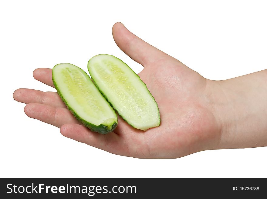 Sliced cucumber in human hand isolated background