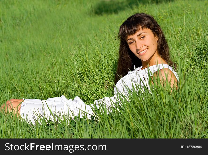 Smiling girl on the meadow