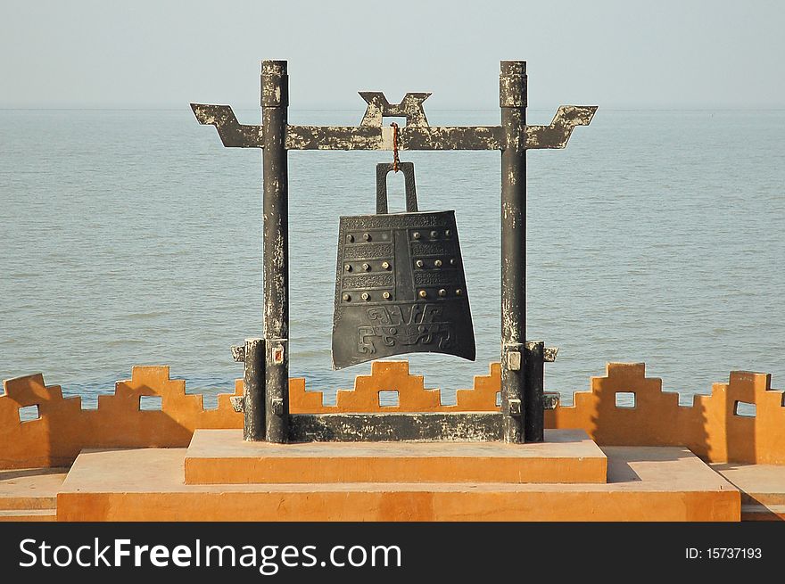 A traditional war-warning bell on coastline.Used by chinese coast guard in some hundreds of years ago. A traditional war-warning bell on coastline.Used by chinese coast guard in some hundreds of years ago
