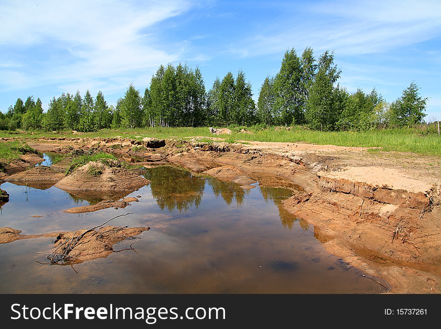 Small lake on old sandy quarry