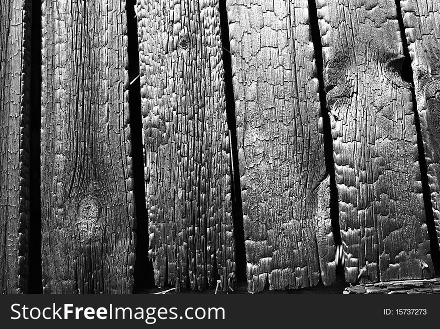 Burnt wooden planks in close up - background. Burnt wooden planks in close up - background