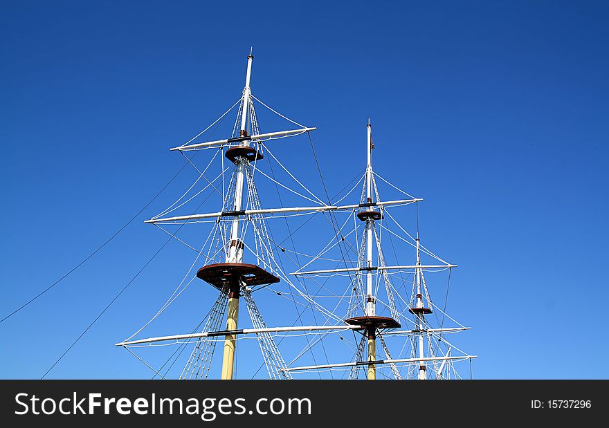 Ship mast on blue background