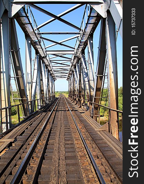 Railway bridge through small river