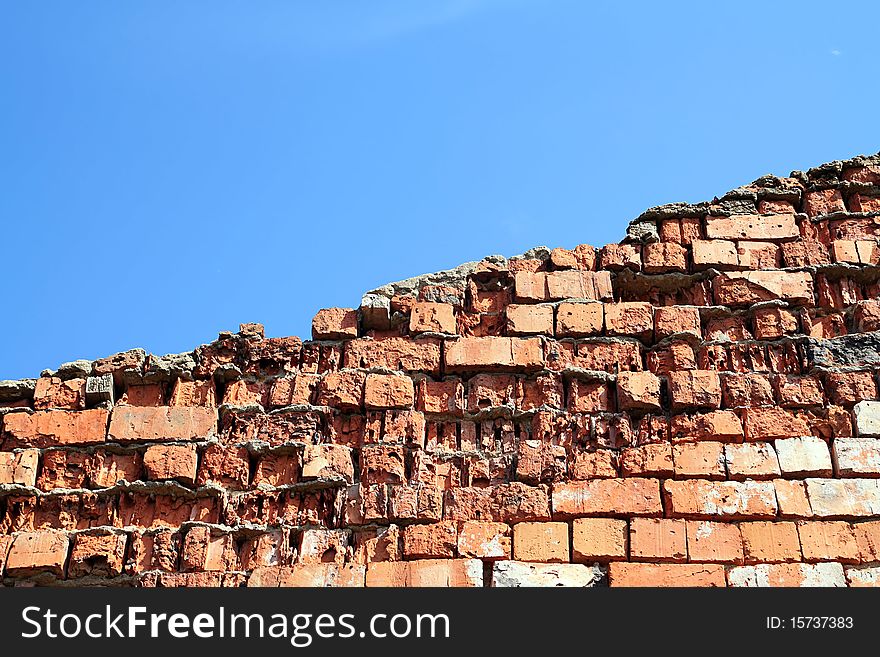 Aging brick wall on celestial background