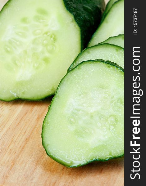 Sliced fresh cucumber on the chopping-board