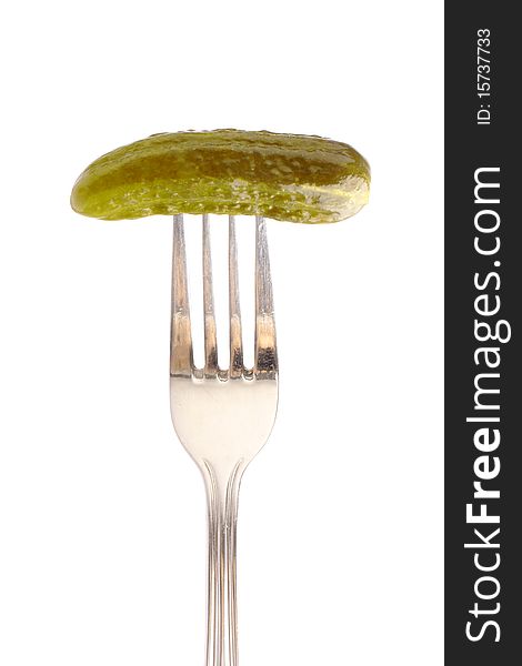 Marinated cucumber on fork (close up, clipping path)