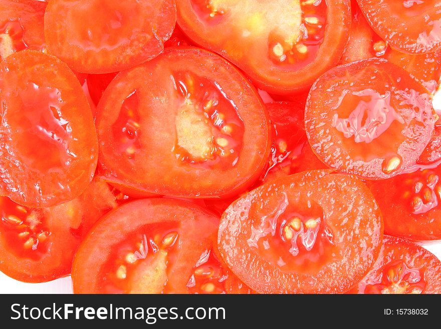 Sliced ripe yummy tomatoes on white background