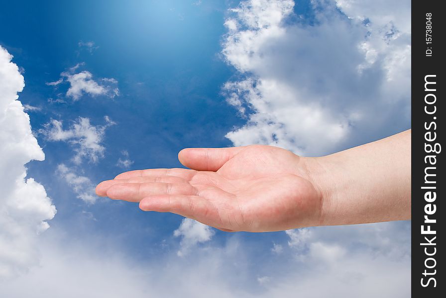 Man hand on blue sky