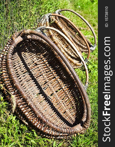 Four baskets on the green grass in the countryside. Four baskets on the green grass in the countryside