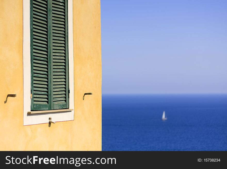 A view marine horizon with a sailboat in the distance - Italy. A view marine horizon with a sailboat in the distance - Italy