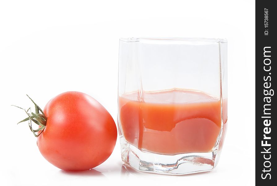 Tomato juice in glass over white