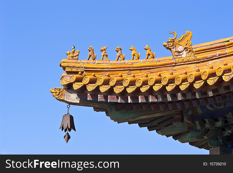 At a corner of the Summer Palace, a delicately decorated eaves with gilded roof, beautiful frieze, and dragon patterns. At a corner of the Summer Palace, a delicately decorated eaves with gilded roof, beautiful frieze, and dragon patterns.