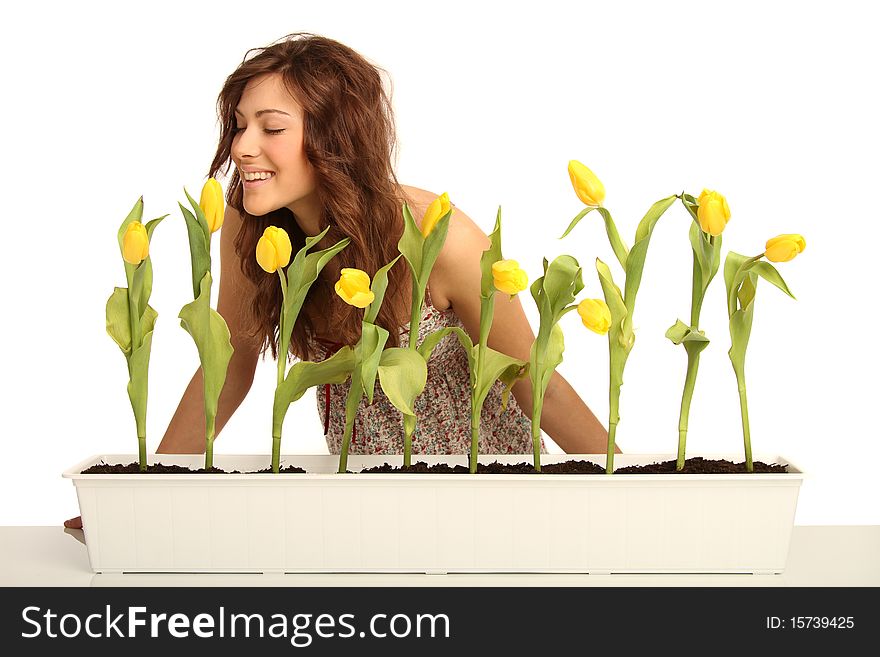 Young brunette woman with yellow flowers. Young brunette woman with yellow flowers