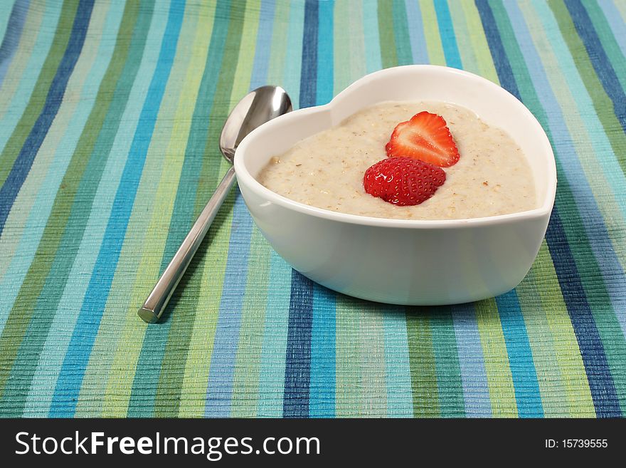 Porridge In A Heart Shaped Bowl With Strawberries