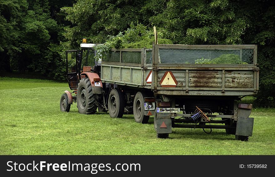 Tractor standing in the park. Tractor standing in the park