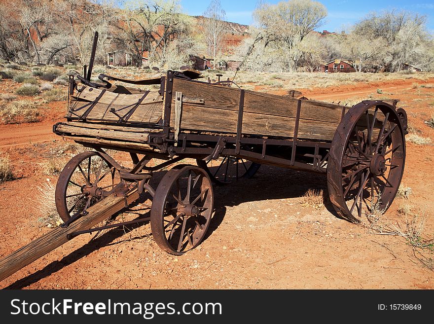 Old Farm equiptment in the desertwith blue sky and clouds in the background. Old Farm equiptment in the desertwith blue sky and clouds in the background