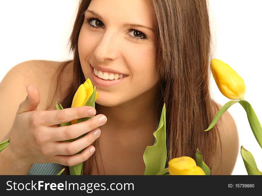 Young brunette woman with yellow flowers. Young brunette woman with yellow flowers