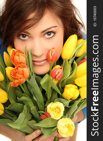 Young brunette woman with yellow and red flowers. Young brunette woman with yellow and red flowers