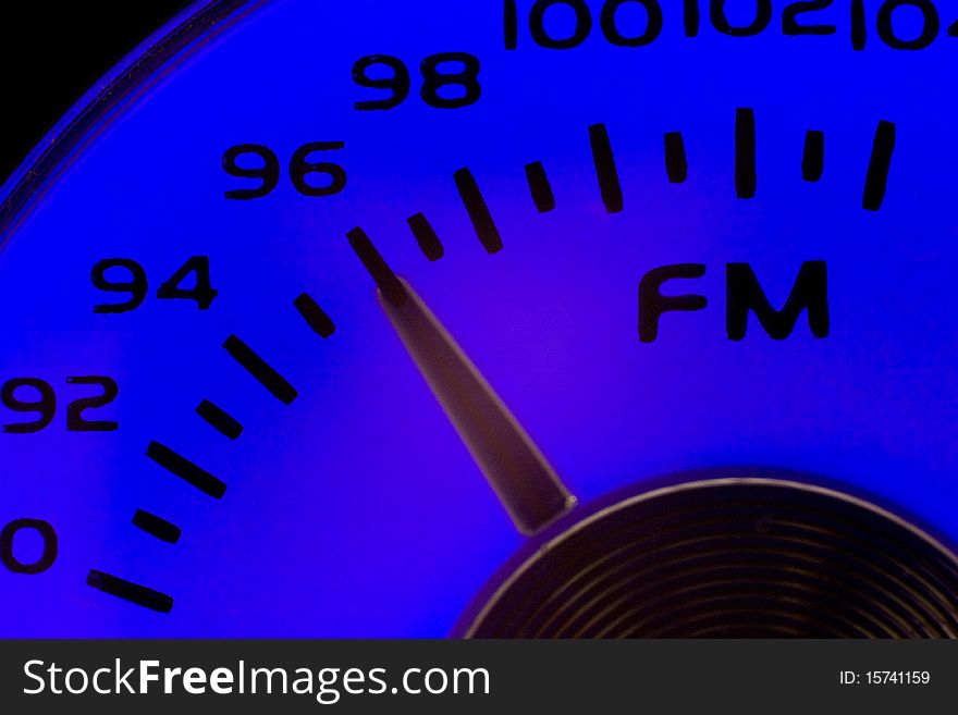 Close-up of an old fashioned FM dial in blue