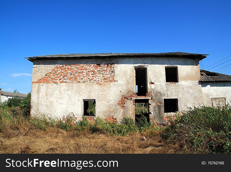 Old ruined house on celestial background