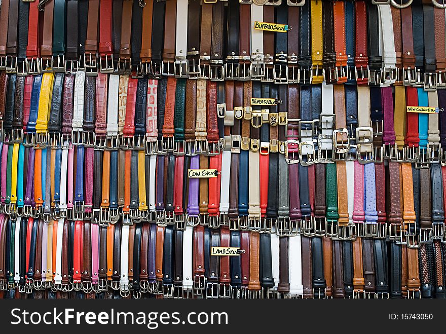 A wide selection of different belts on a market stall in Italy. A wide selection of different belts on a market stall in Italy.