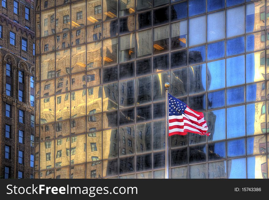 America flag against glassy buildings. America flag against glassy buildings.