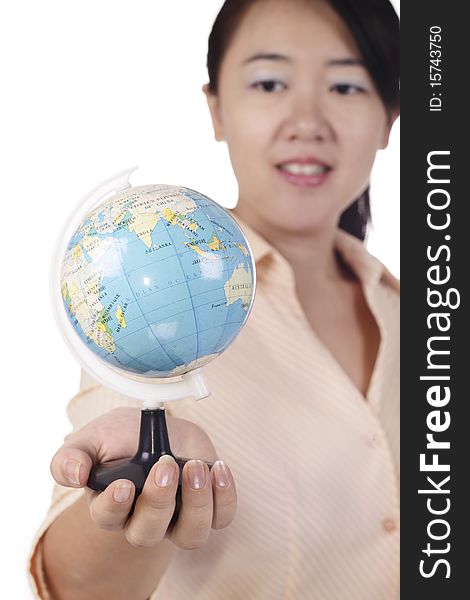 An Asian woman holding a mini globe. An Asian woman holding a mini globe