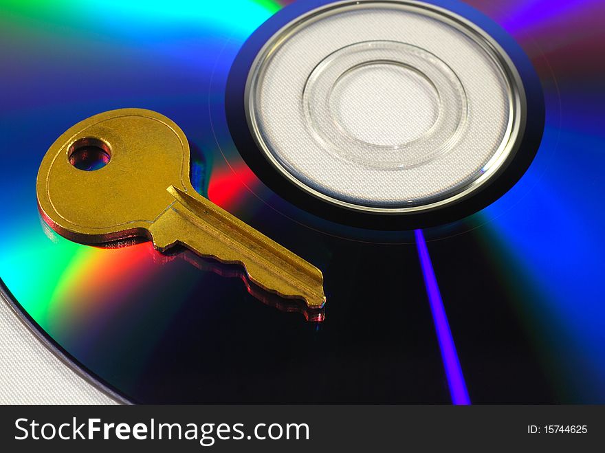 Key on a CD isolated on white concepts of data security