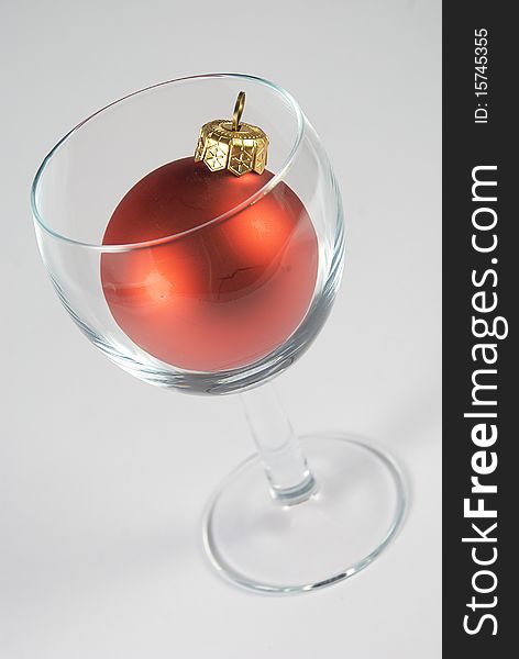 Wineglass with red christmas decoration