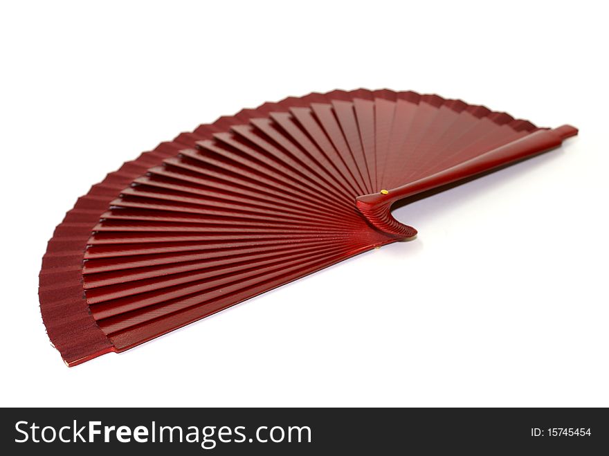 A brown fan for dressing accesorie