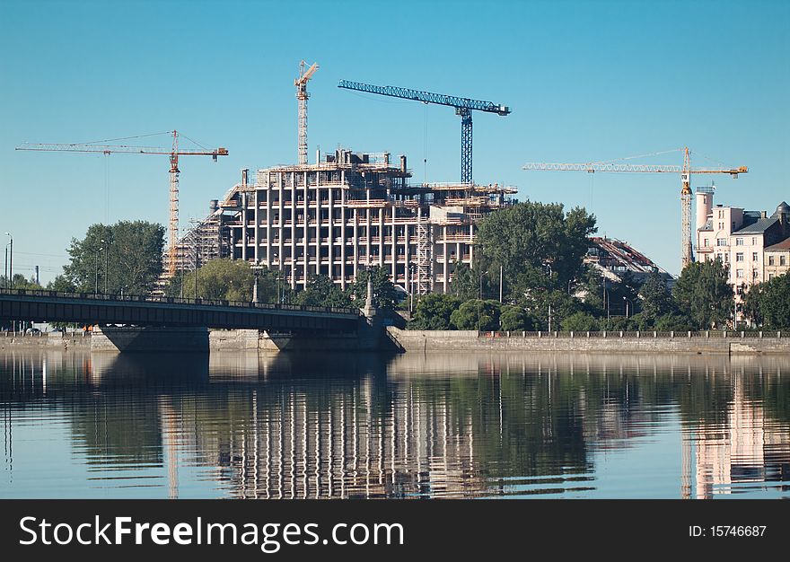 Jib crane construct building near the river