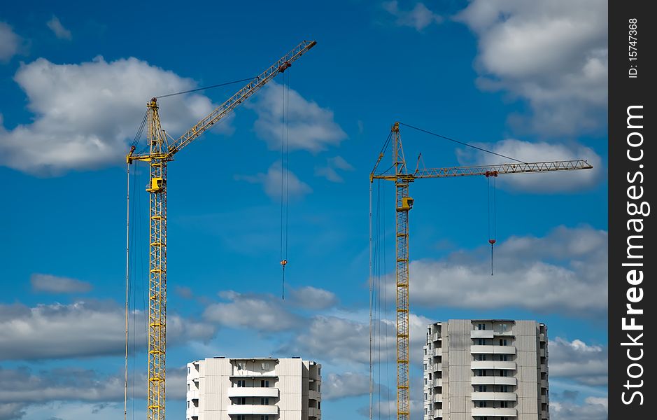 Building of the new high house by the crane. Building of the new high house by the crane