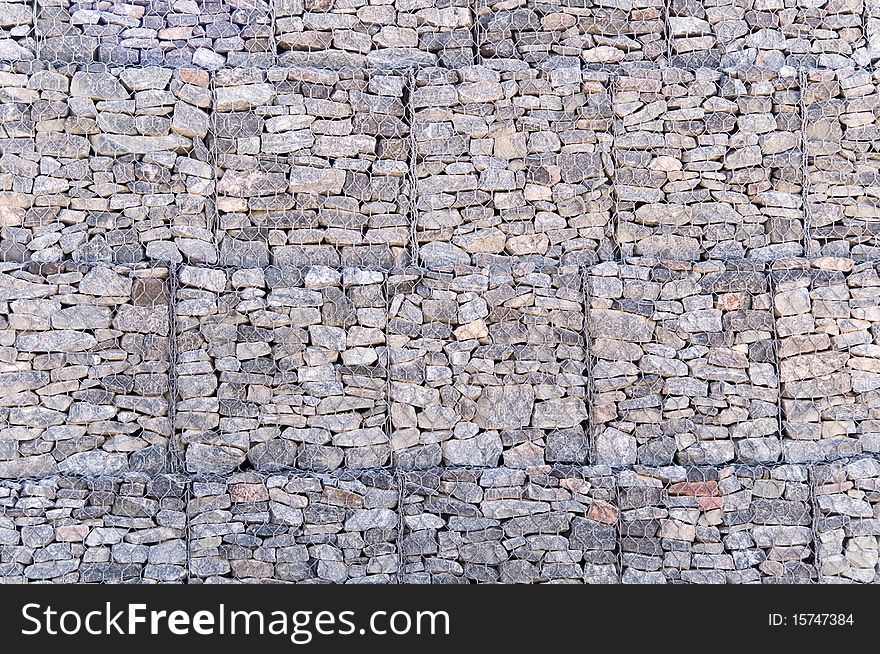 Wall from a granite stone with a grid a background. Wall from a granite stone with a grid a background