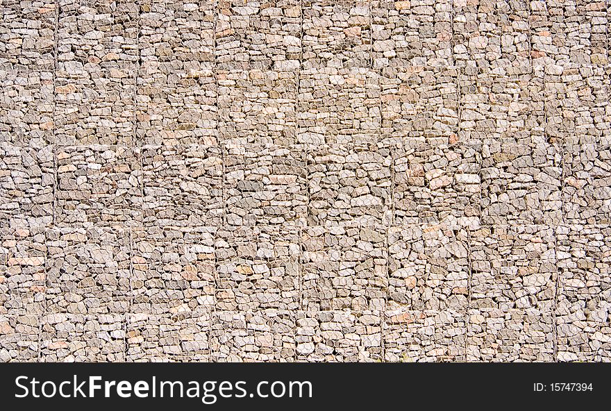 Wall from a granite stone with a grid a background. Wall from a granite stone with a grid a background