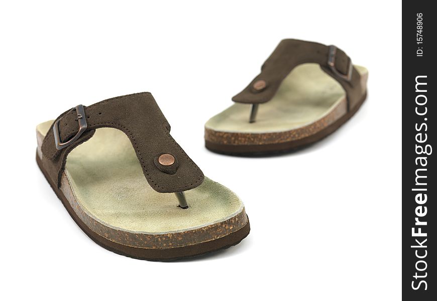 Brown sandals isolated against a white background