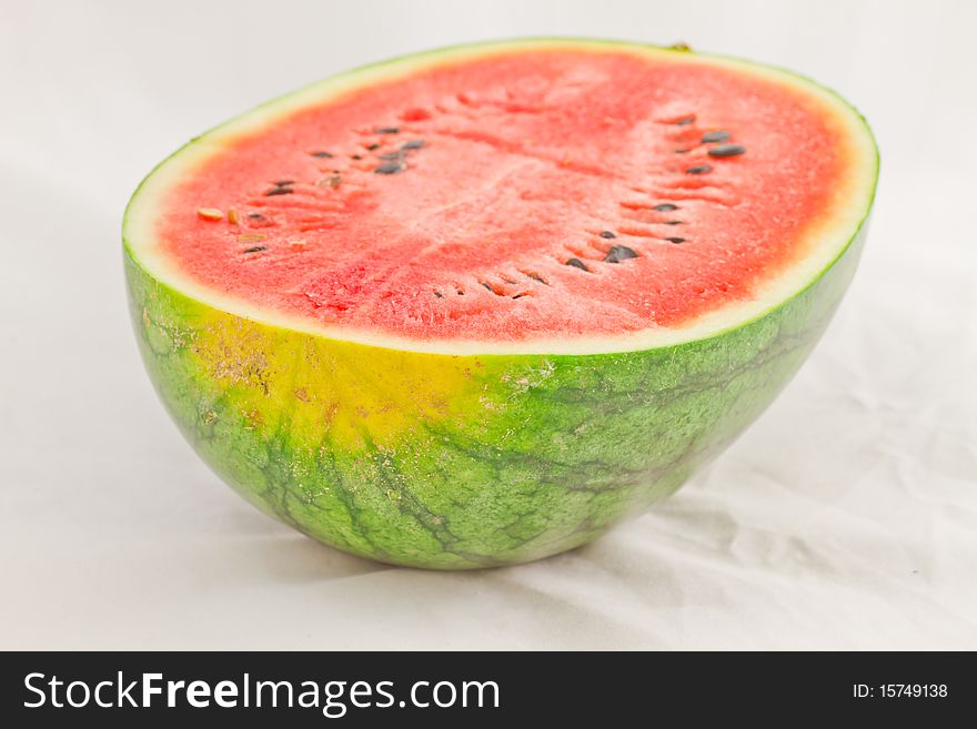 Half of Ripe Sliced Green Watermelon  on White Background. Half of Ripe Sliced Green Watermelon  on White Background.