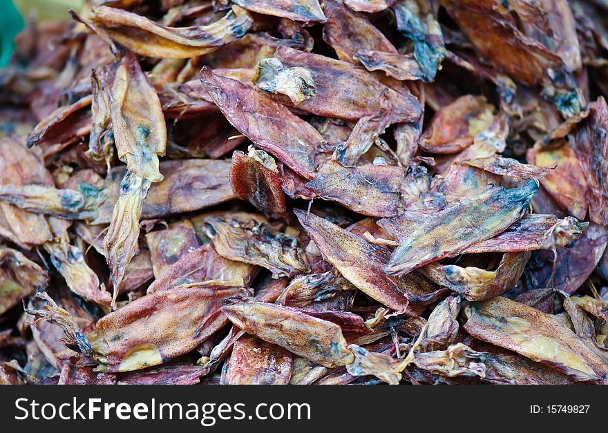 Dried squid in market background