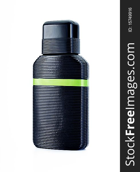 Black bottle with green stripe on a white background, perfume container