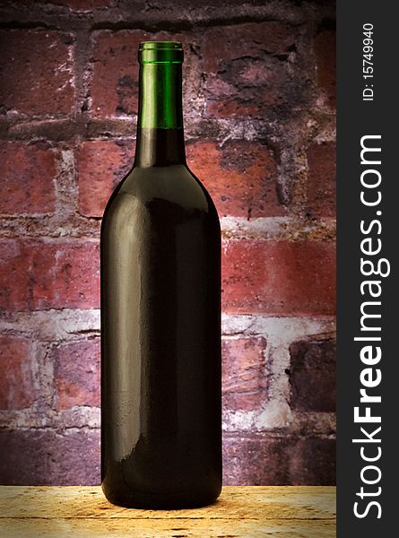 Green Wine bottle on brick backbround