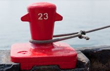 Red Dock Cleat Securing A Ship Stock Images Red Dock Cleat Securing A Ship Stock Images