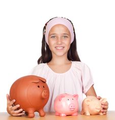 Little Girl With With Three Piggy-bank Royalty Free Stock Photo