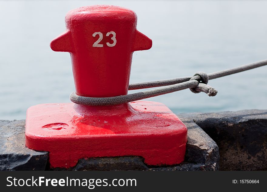 Red Dock Cleat Securing A Ship