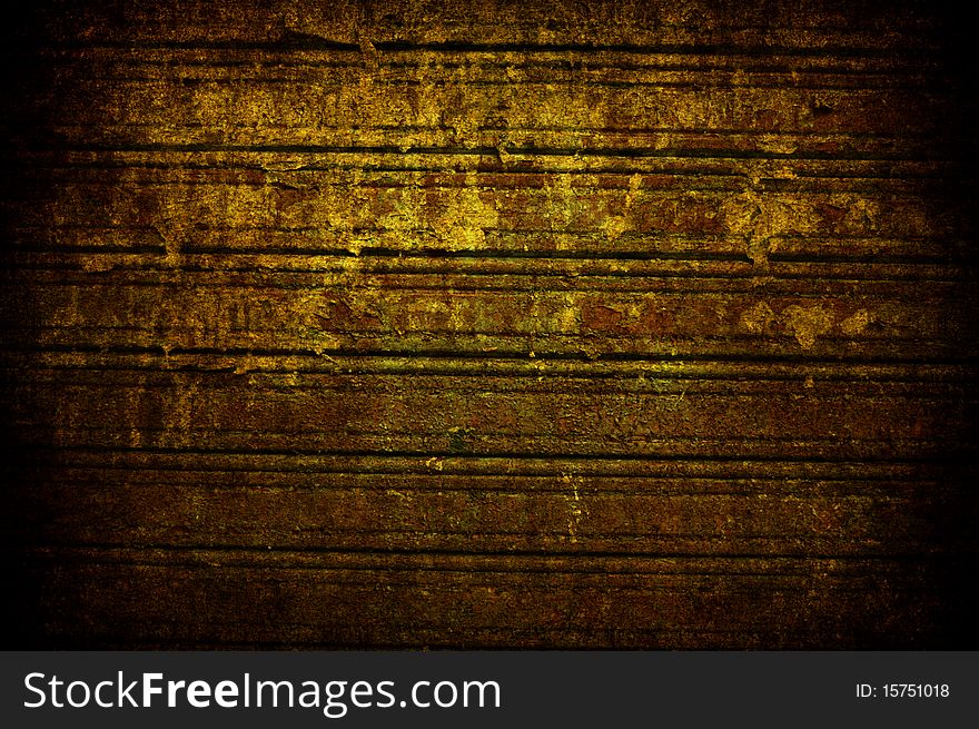 A grunge old rusted yellow metal shutter. A grunge old rusted yellow metal shutter