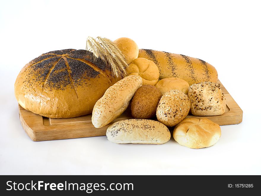 Fresh bread on the board on the white background