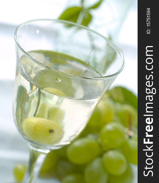 White wine and grape in glass outside close up shoot