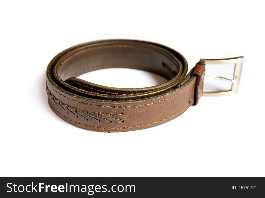 A  leather belt isolated on white background. A  leather belt isolated on white background