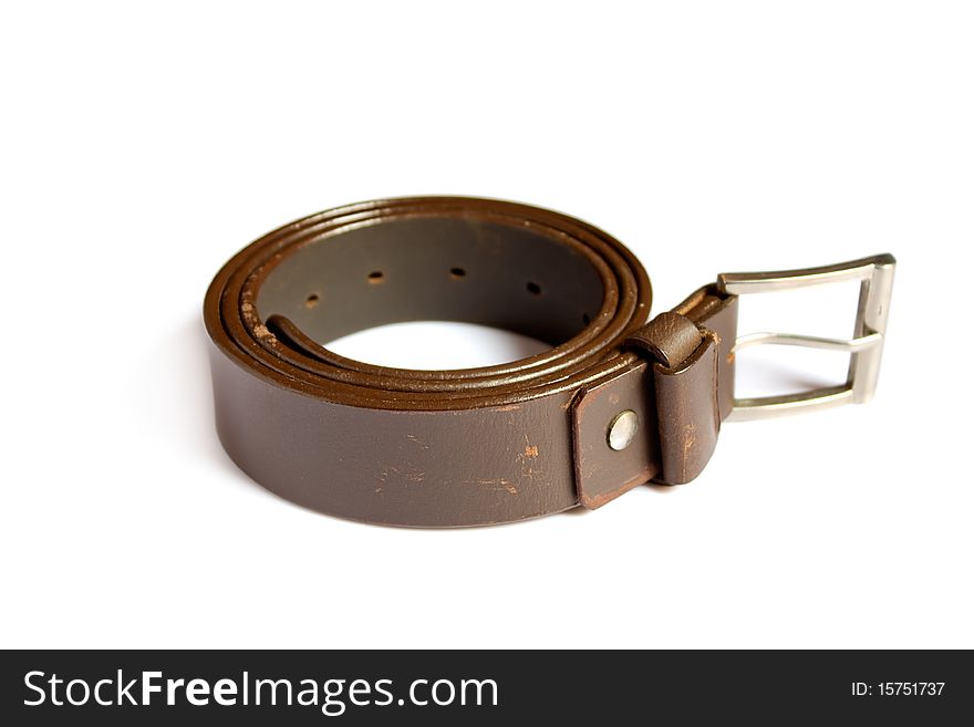A  leather belt isolated on white background. A  leather belt isolated on white background